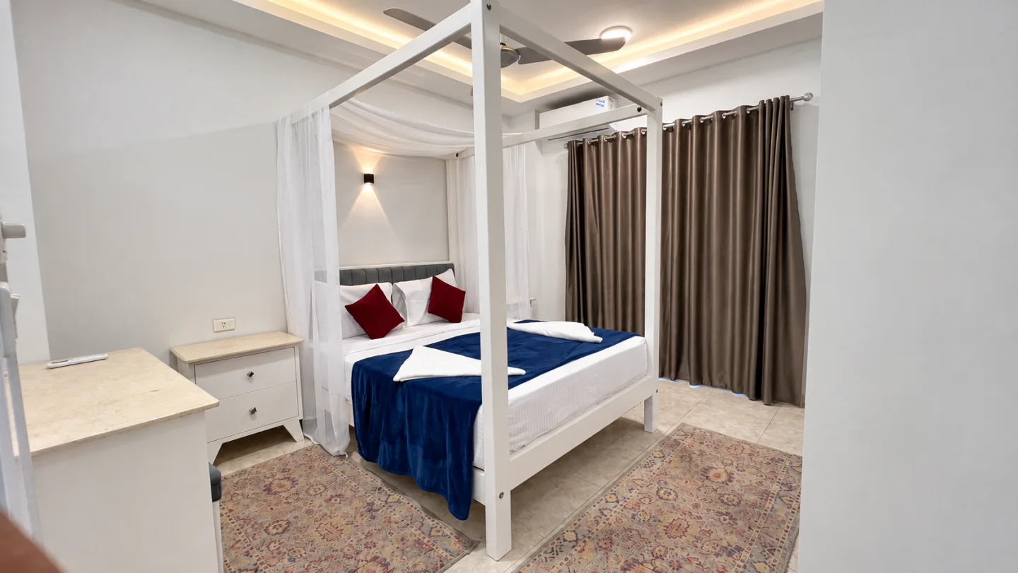 Queen bedroom with a canopy bed