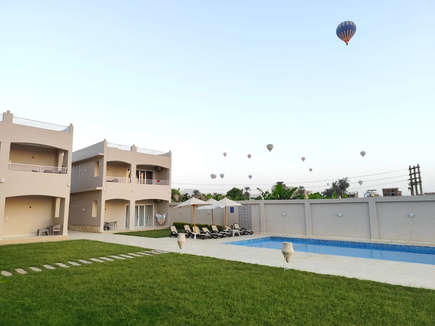 Royal Nile Villas garden and pool in daylight